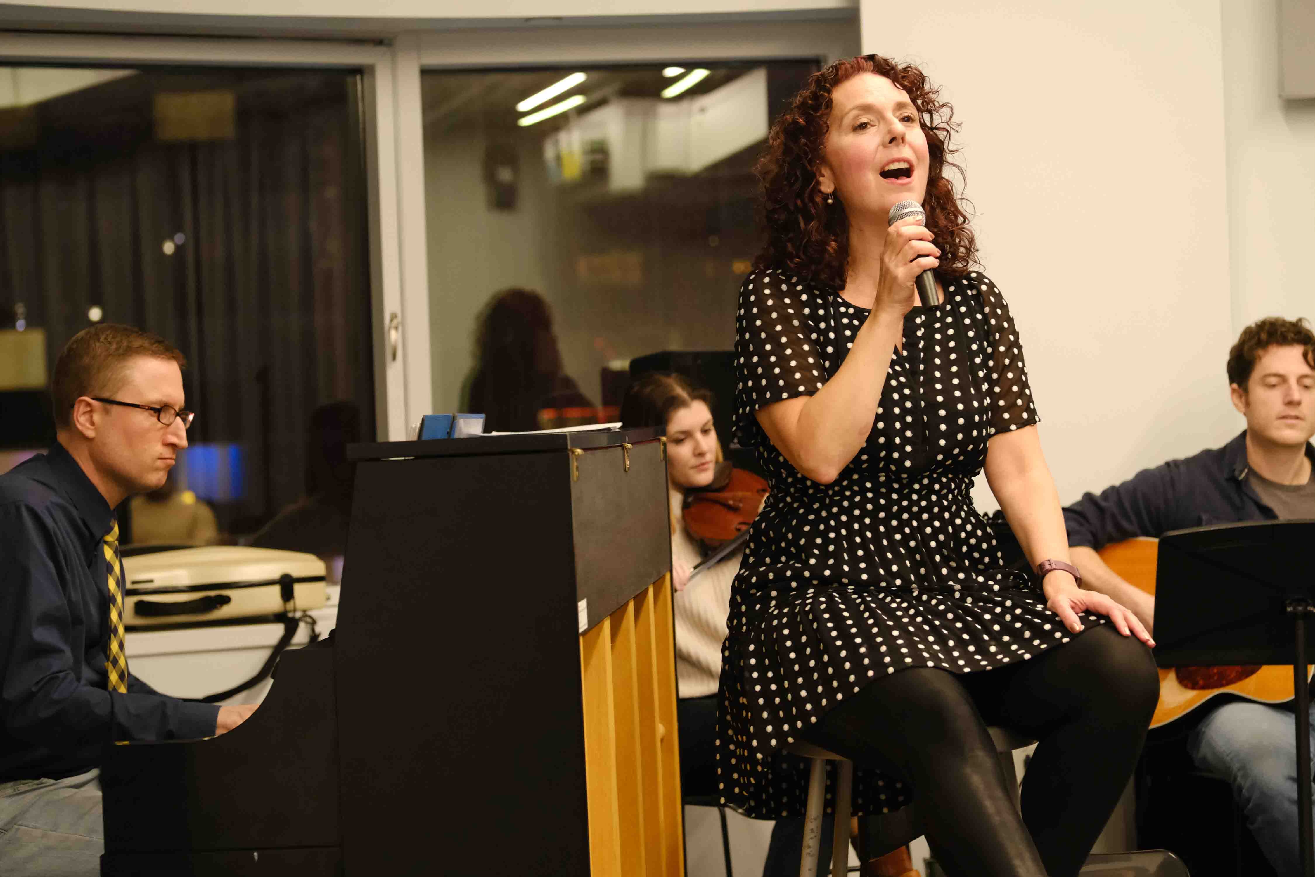 Meg singing in rehearsal